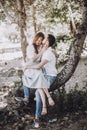 Happy stylish couple in love hugging and kissing in summer park Royalty Free Stock Photo