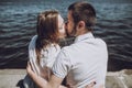 Happy stylish couple in love kissing on the beach in summer city Royalty Free Stock Photo