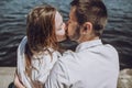 Happy stylish couple in love kissing on the beach in summer city Royalty Free Stock Photo