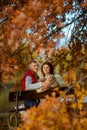 happy stylish couple in park sitting on bench Royalty Free Stock Photo
