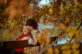 happy stylish couple in park sitting on bench Royalty Free Stock Photo