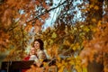 happy stylish couple in the park sitting on bench Royalty Free Stock Photo