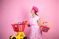 Happy stylish girl enjoying online shopping. savings on purchases. vintage housewife woman ready to pay in supermarket Royalty Free Stock Photo