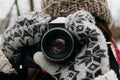 Happy stylish gorgeous girl with photocamera in beautiful snowy Royalty Free Stock Photo