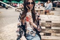 happy stylish hipster woman in sunglasses with lemonade. boho gi