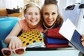 Happy stylish mother and daughter with beach holiday luggage Royalty Free Stock Photo