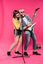 Happy stylish senior couple playing electric guitar and singing Royalty Free Stock Photo