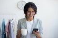 Happy stylist enjoying pause break time with cup of coffee.