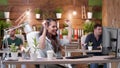 Happy succesful excited businesswoman sitting at desk table having raised hands