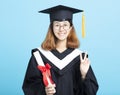 success graduation girl with victory gesture Royalty Free Stock Photo