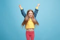 Happy success teen girl celebrating being a winner. Dynamic energetic image of female model Royalty Free Stock Photo