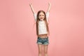 Happy success teen girl celebrating being a winner. Dynamic energetic image of female model Royalty Free Stock Photo