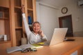 Happy and successful attractive middle aged Asian woman working at office laptop computer desk excited and cheerful celebrating Royalty Free Stock Photo