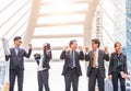 Happy Successful business group People Hands Raised successful with city background Successful business group with arms up Royalty Free Stock Photo