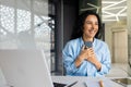 Happy and successful business woman received online notification with good news on her phone, Hispanic woman celebrating Royalty Free Stock Photo