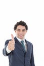 Happy successful businessman showing thumbs up gesture