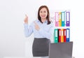 Happy and successful businesswoman raising her arms at office background and showing something isolated on white. mock up Royalty Free Stock Photo