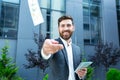 Happy successful Caucasian bearded businessman counts, waves, throws, show off, flaunt cash money background a modern office Royalty Free Stock Photo