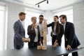 Happy successful diverse business team of different ages building tower Royalty Free Stock Photo