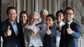 Happy successful diverse businesspeople employees group showing thumbs up Royalty Free Stock Photo