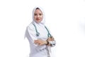 Happy successful female Asian Muslim nurse or doctor, smiling confidently with crossed arms Royalty Free Stock Photo