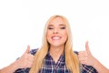 Happy successful girl with beaming smile showing thumbs up Royalty Free Stock Photo