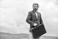 happy and successful man hold money case. bearded man show office briefcase. good business deal. successful business