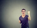 Happy successful man winning, fists pumped celebrating success Royalty Free Stock Photo