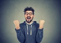 Happy successful man winning, fists pumped celebrating success Royalty Free Stock Photo