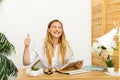 Cheerful young office worker showing thumbs up Royalty Free Stock Photo