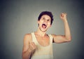 Happy successful student, man winning fists pumped celebrating success Royalty Free Stock Photo