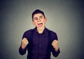 Happy successful student man winning fists pumped celebrating success Royalty Free Stock Photo