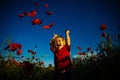 Happy summer. Child in poppy field. Kid with red flowers nature. Happy walk. Royalty Free Stock Photo