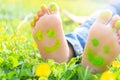 Happy summer day.Child lying on green grass.