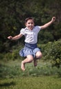 Happy summer girl teenager jumping outdoor. Royalty Free Stock Photo