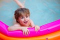 Happy summer pool. Good mood. Water for kids game. The child swims in the pool. Rest in a sea hotel. Home entertainment Royalty Free Stock Photo