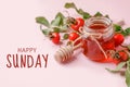 Happy sunday. Fresh rose hip berries and honey on pink background, copy space. Ingredient for winter autumn fall seasonal hot