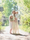 Happy sunny family, mother with her daughters Royalty Free Stock Photo