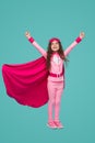 Happy superhero girl flying with raised arms Royalty Free Stock Photo