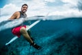 Happy surfer waits the wave on line up