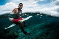 Happy surfer waits the wave on line up