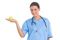 Happy surgeon holding an apple Royalty Free Stock Photo