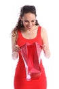 Happy surprise present in red bag for young woman Royalty Free Stock Photo