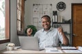 Happy surprised African American businessman reading good news in letter, celebrating success, excited young man holding Royalty Free Stock Photo