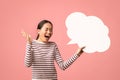 Happy Surprised Asian Woman Holding Blank Speech Bubble And Exclaiming With Excitement Royalty Free Stock Photo
