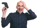 Happy surprised bald guy with a joystick