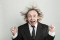 Happy surprised excited businessman with hair up standing on white background, studio portrait Royalty Free Stock Photo