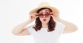 Happy surprised and excited woman in summer hat, sunglasses and template white t shirt isolated on white background. Holiday