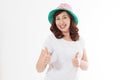 Happy surprised and excited woman in summer hat and template white t shirt isolated on white background. Holiday vacation with big