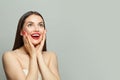 Happy surprised woman with red manicured nails on hands on white banner background Royalty Free Stock Photo